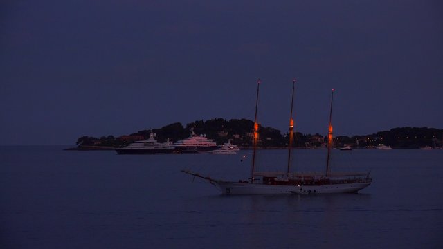 Sailboats drift on the water along France's amazing Cote D'Azur.