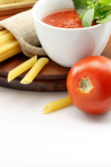 Tomato sauce with fresh basil leaves and tomatoes, with copy-space