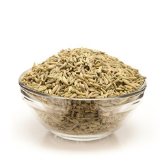 Front view of Organic Aniseed (Pimpinella anisum) in glass bowl isolated on white background.