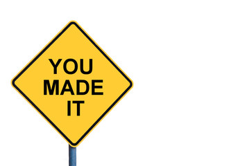 Yellow roadsign with YOU MADE IT message