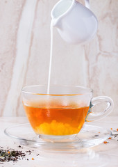 Cup of hot tea with milk