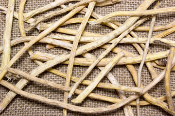 Horseradish root on sacking background