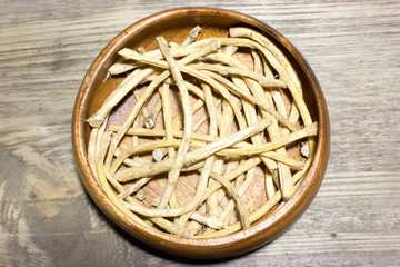 Horseradish root on wooden background