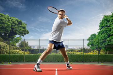Young man is playing tennis
