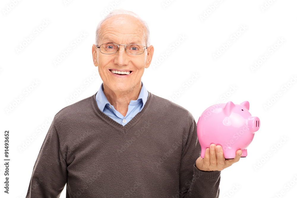 Poster senior gentleman holding a pink piggybank