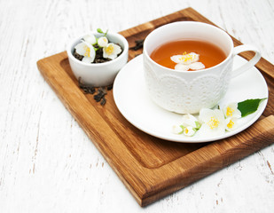 Cup of tea with jasmine flowers