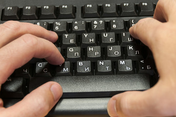 man hands typing on a  keyboard