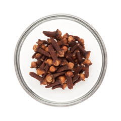 Top view of Organic black clove (Syzygium aromaticum) half filled in glass bowl isolated on white background.