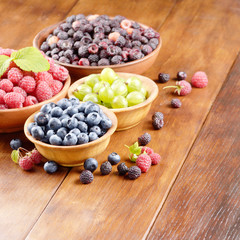 Wooden bowls with organic berries