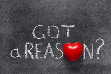 got a reason question handwritten on chalkboard with red heart used instead of O