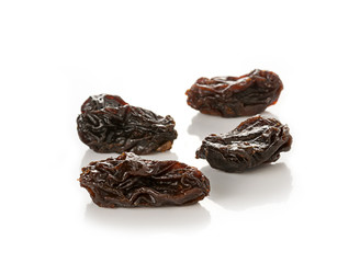 Dried raisins on white background