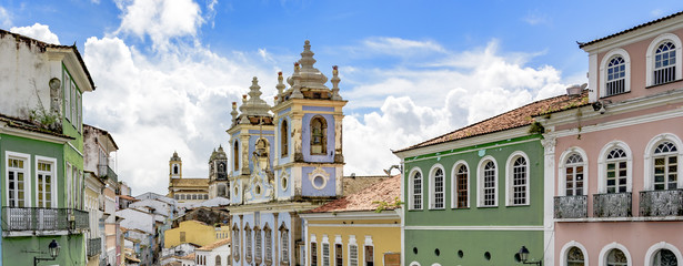 Facades of the old houses and townhouses and towers of historic churches in Pelourinho neighborhood in Salvador, Bahia - obrazy, fototapety, plakaty