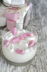 Fresh homemade yogurt with marshmallow slices in a glass