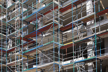 building facade with scaffoldings -construction site 