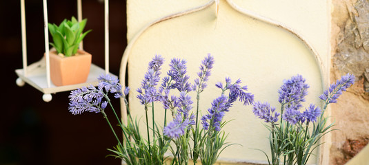 Decorative lavander and other flowers in pot