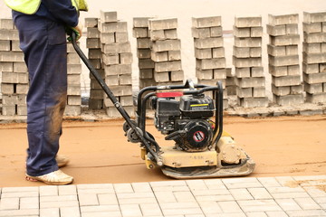 tamping sand for paving laying
