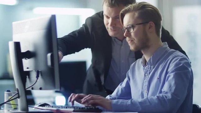 Businessman Have Discussion with Trainee on Workplace