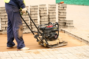 tamping sand for paving laying