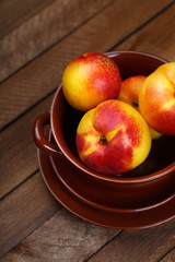 top view of peaches on a wooden background