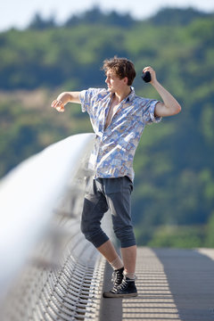 Young Man Standing on the Bridge