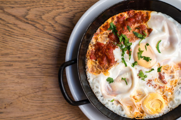 Oriental omelette  in a tomato paprika ragout with fresh herbs