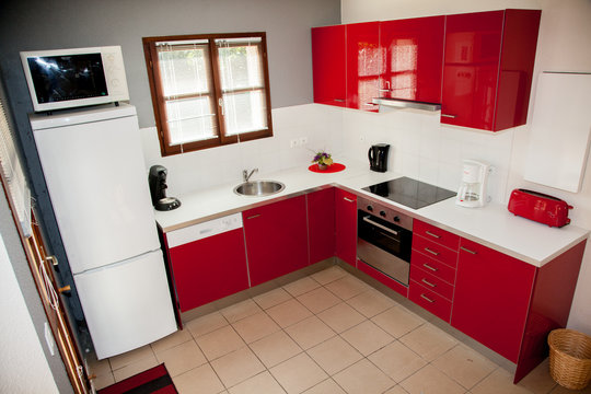 Modern red kitchen, in a house