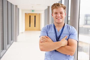Fototapeta premium Portrait Of Male Nurse Standing In Hospital Corridor
