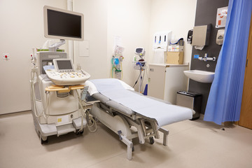 Treatment Area In Modern Hospital With Ultrasound Equipment