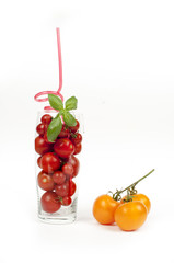 red tomato cocktail with basil and yellow tomatoes