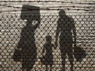 Refugees behind a fence