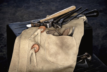 Farrier Tools with Chaps on Stool