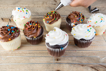 Homemade white and chocolate cupcakes.