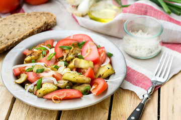 Warm autumn salad with eggplant, tomato, onion