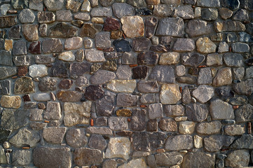 The walls are built of stones of different colors correct form