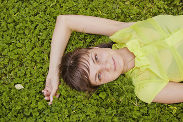 beautiful girl lying on the grass