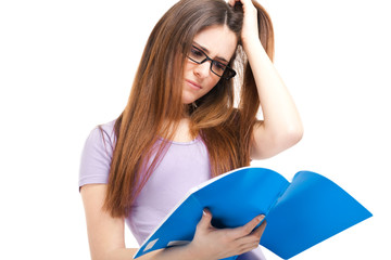 Student with desperate expression looking at her book