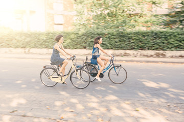 A couple of friends with bikes, motion blur.