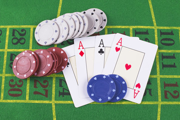 Aces and poker rooms on green carpet