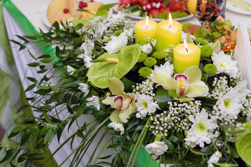 Bouquet of wedding flowers, decorated with candles