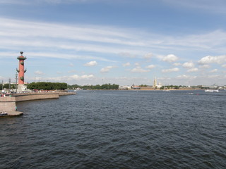 View at the Admiralty across Neva River and Rostral Columns at the Spit of Vasilievsky Island in Saint Petersburg, Russia