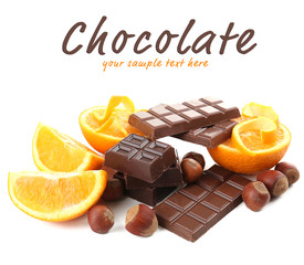Chocolate, orange and  hazelnuts isolated on white
