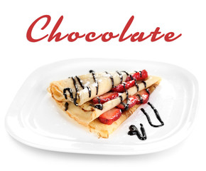Delicious pancake with strawberries and chocolate on plate isolated white