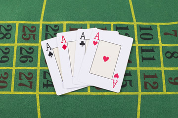 Aces poker on green carpet