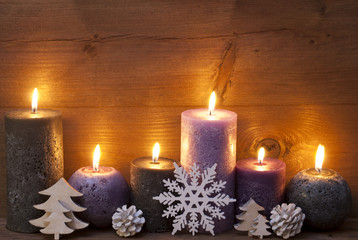 Obraz na płótnie Canvas Christmas Decoration With Puprle And Black Candles, Snowflake