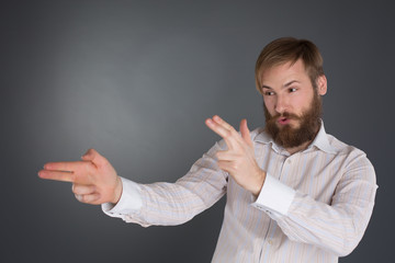 Young man posing with finger-guns