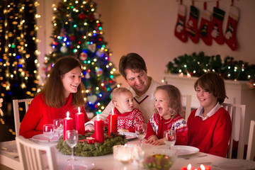 Family enjoying Christmas dinner at home