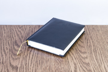 Simple blue leather note with yellow bookmark 