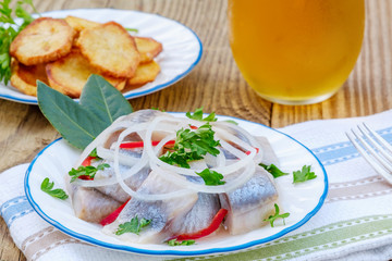 Piece of Herring,  Potato Chips, and Glass of Beer