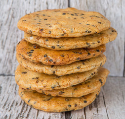 Japanese rice crackers, locally known as senbei over wooden background