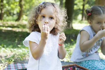 children eat outdoors